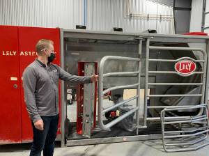 West Coast Robotics project manager Jesse Wheeler opens the door to a Lely Astronaut milking machine. WCR is partnering with Delta Irrigation of Chilliwack to create new agricultural solutions. (File)